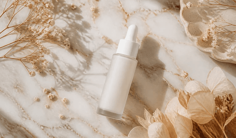 Skincare serum on a marble surface